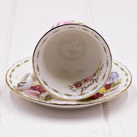Vintage floral teacup and saucer with gold trim, elegant home décor accent piece