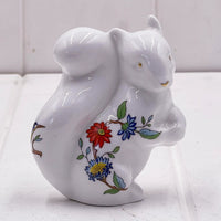 White porcelain squirrel figurine with floral design, home décor accent piece