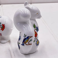 White porcelain squirrel figurine with colorful floral and bird design, elegant home décor accent