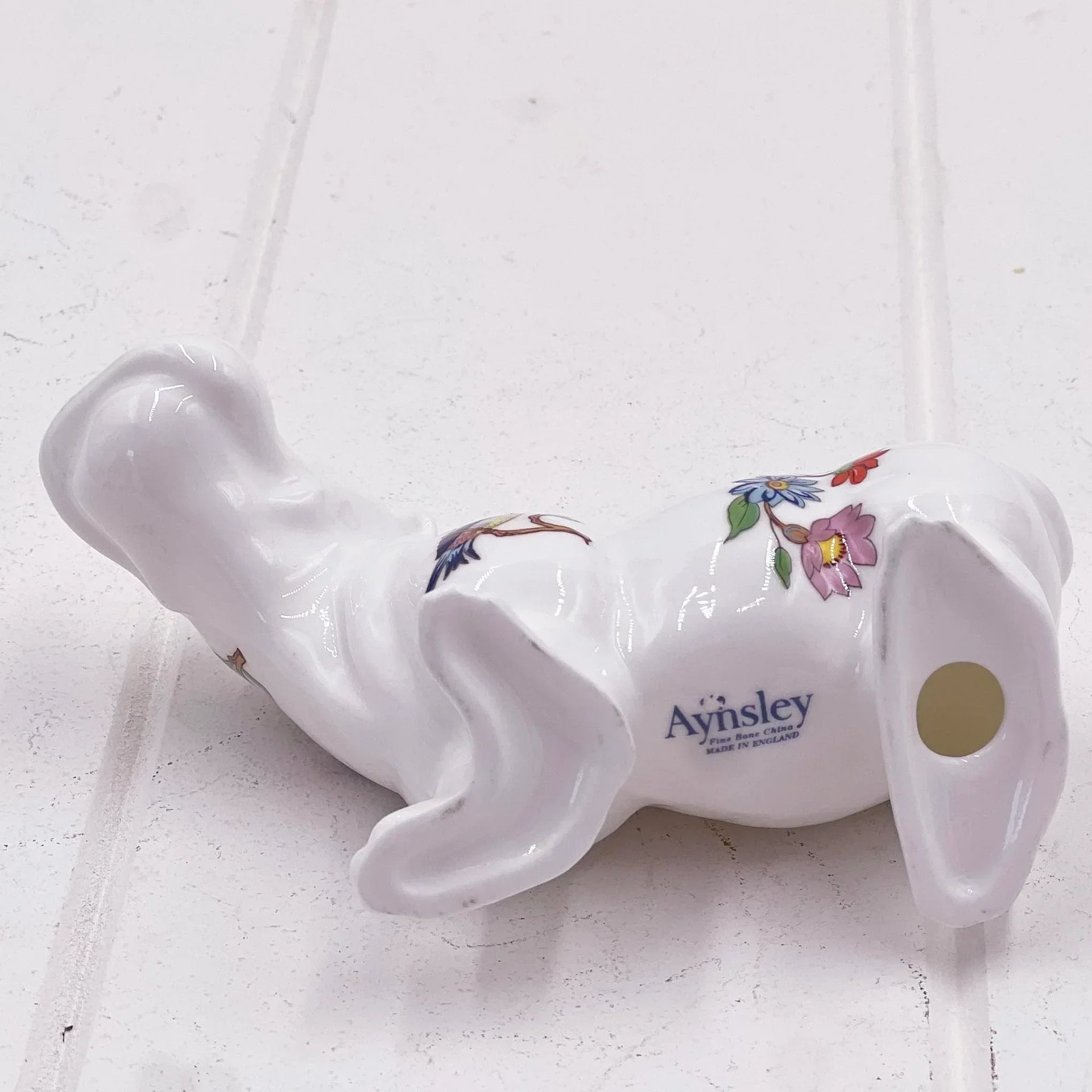 Ayinsley fine bone china dog figurine with floral design, elegant home decor piece
