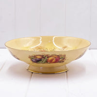 Vintage fruit-patterned ceramic bowl with gold trim, perfect for home décor or serving