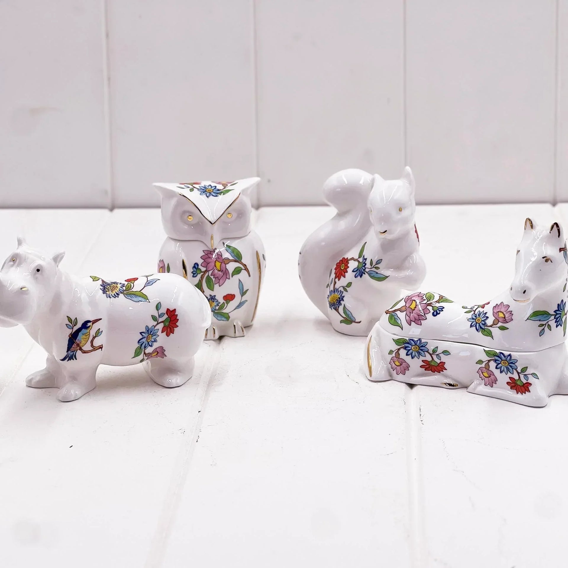 Floral porcelain animal figurines: owl, squirrel, horse, hippo with gold accents for home décor