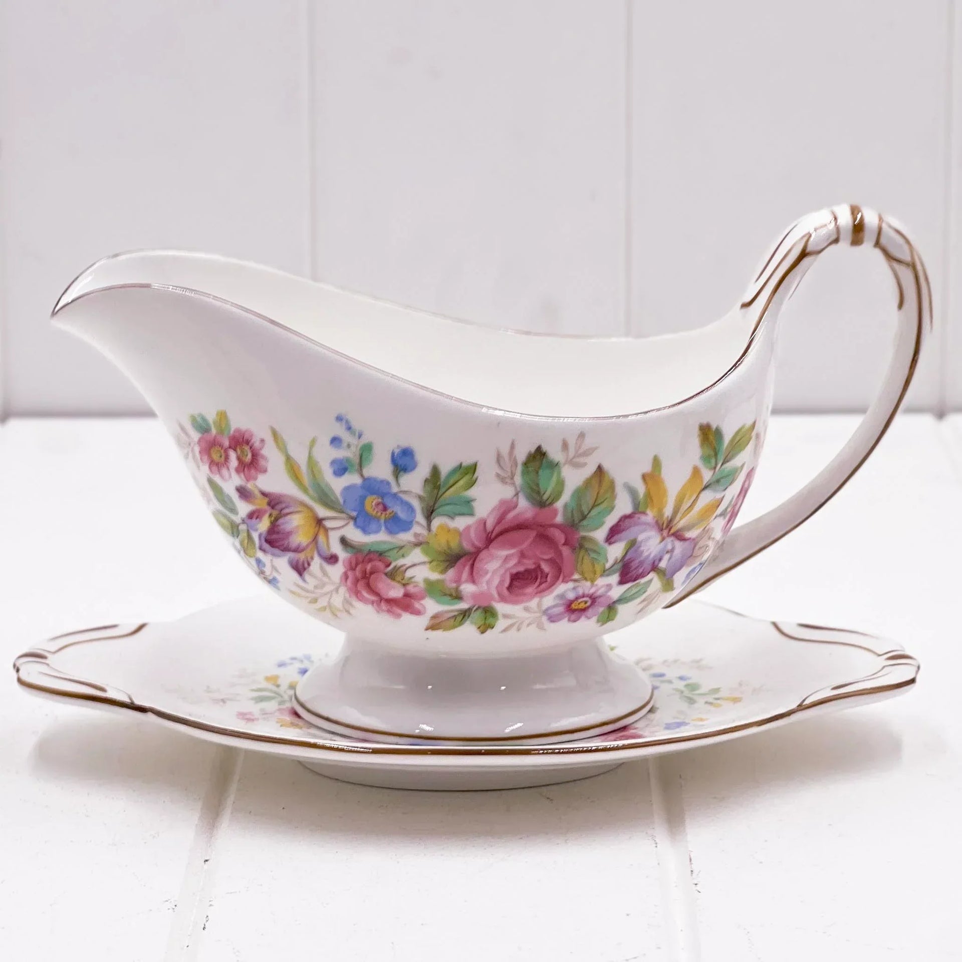Elegant floral gravy boat with matching saucer, vintage porcelain home decor