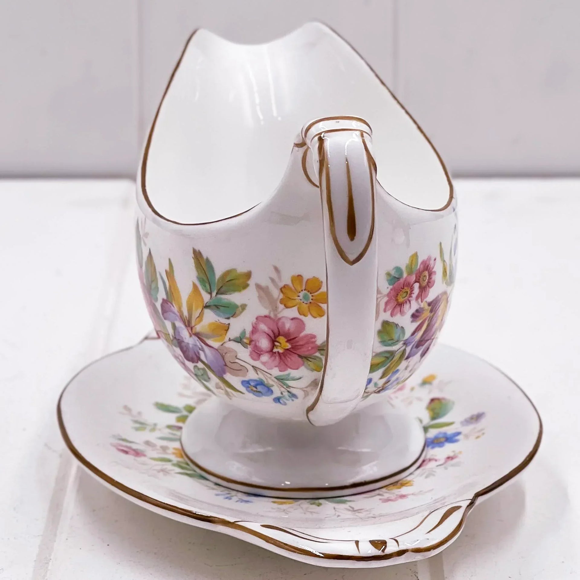 Vintage floral gravy boat with gold trim, elegant porcelain serving piece for home dining decor