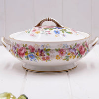 Vintage floral porcelain tureen with lid, gold trim, and colorful rose pattern for elegant home dining