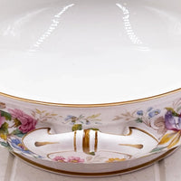 Elegant floral porcelain bowl with gold trim and decorative handles, perfect for vintage home décor