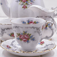 Elegant floral tea cup and saucer with gold trim, vintage porcelain set for home décor
