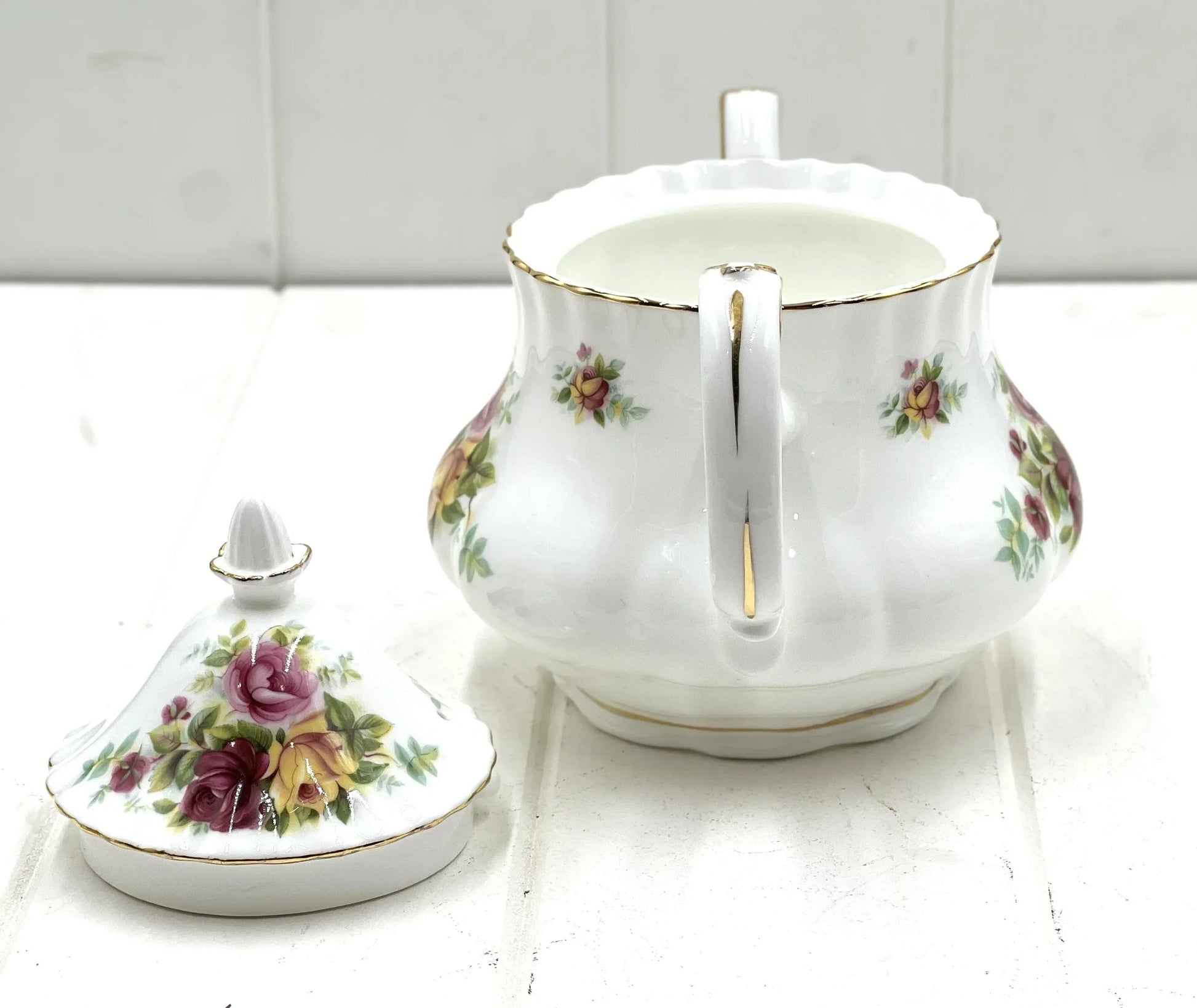 Elegant floral porcelain sugar bowl with gold trim, vintage home decor