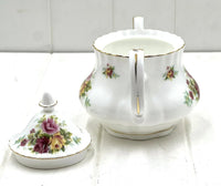 Elegant floral porcelain sugar bowl with gold trim, vintage home decor