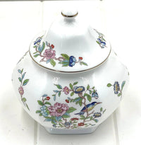 Elegant porcelain jar with floral and bird design, perfect for home décor