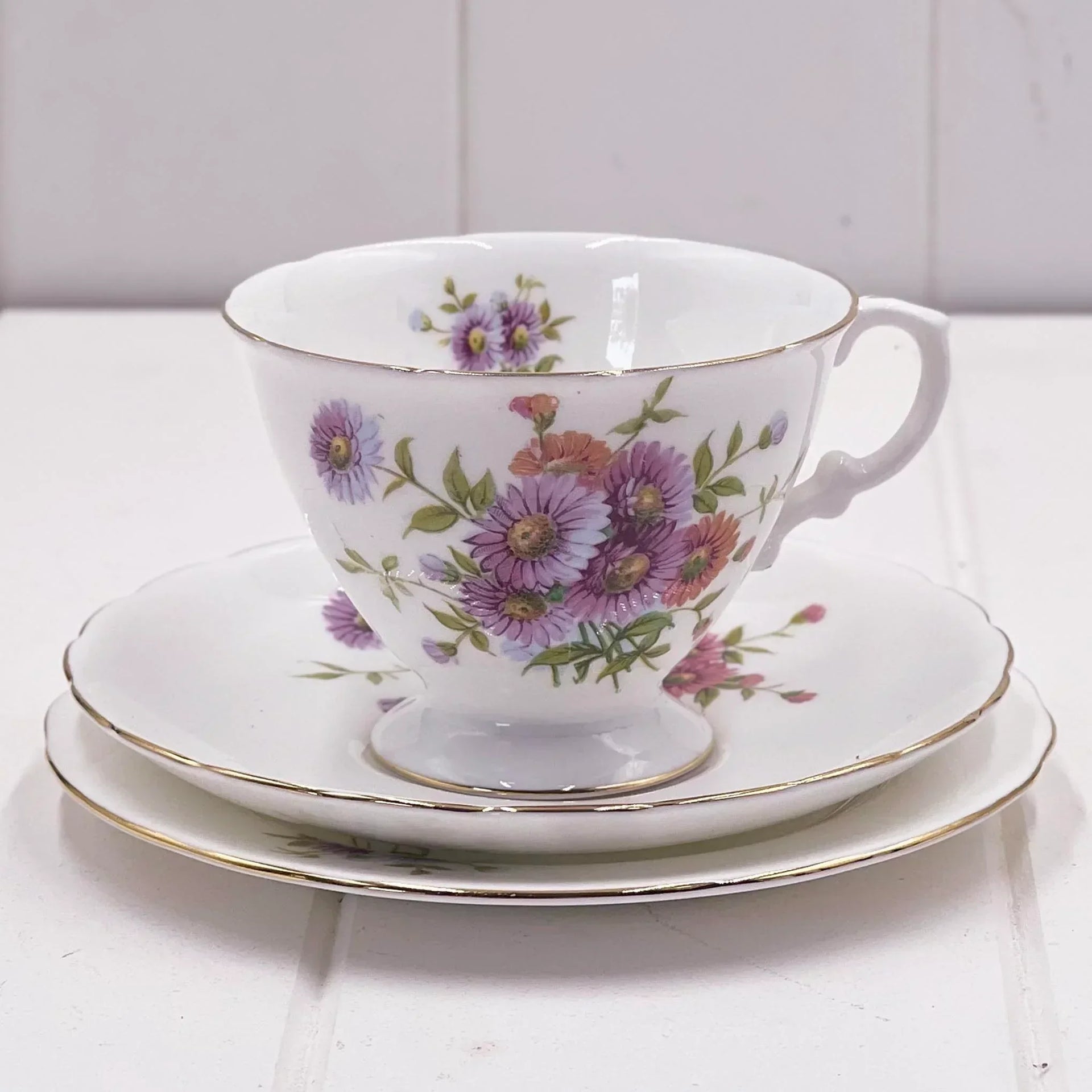 Floral porcelain teacup and saucer set with gold trim, vintage-style home décor
