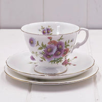 Floral porcelain teacup and saucer set with gold trim, vintage-style home décor