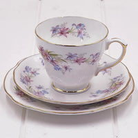 Elegant floral teacup and saucer set with gold trim, vintage-inspired home decor for tea lovers