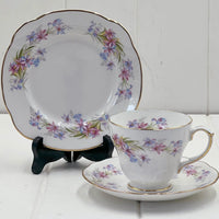 Elegant floral teacup set with gold trim, perfect for vintage home décor