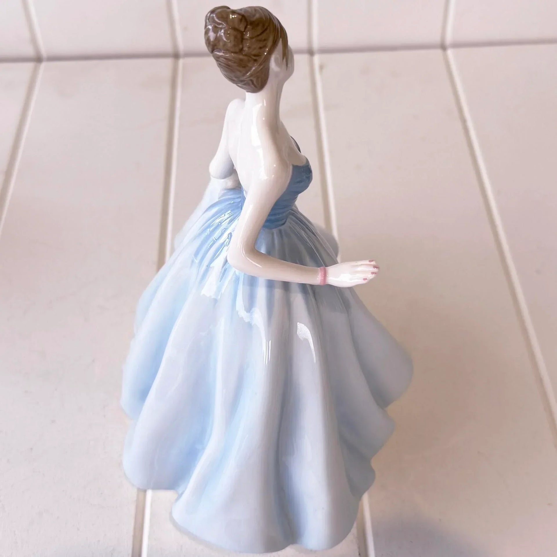 Elegant porcelain figurine of woman in blue gown, vintage home décor accent piece