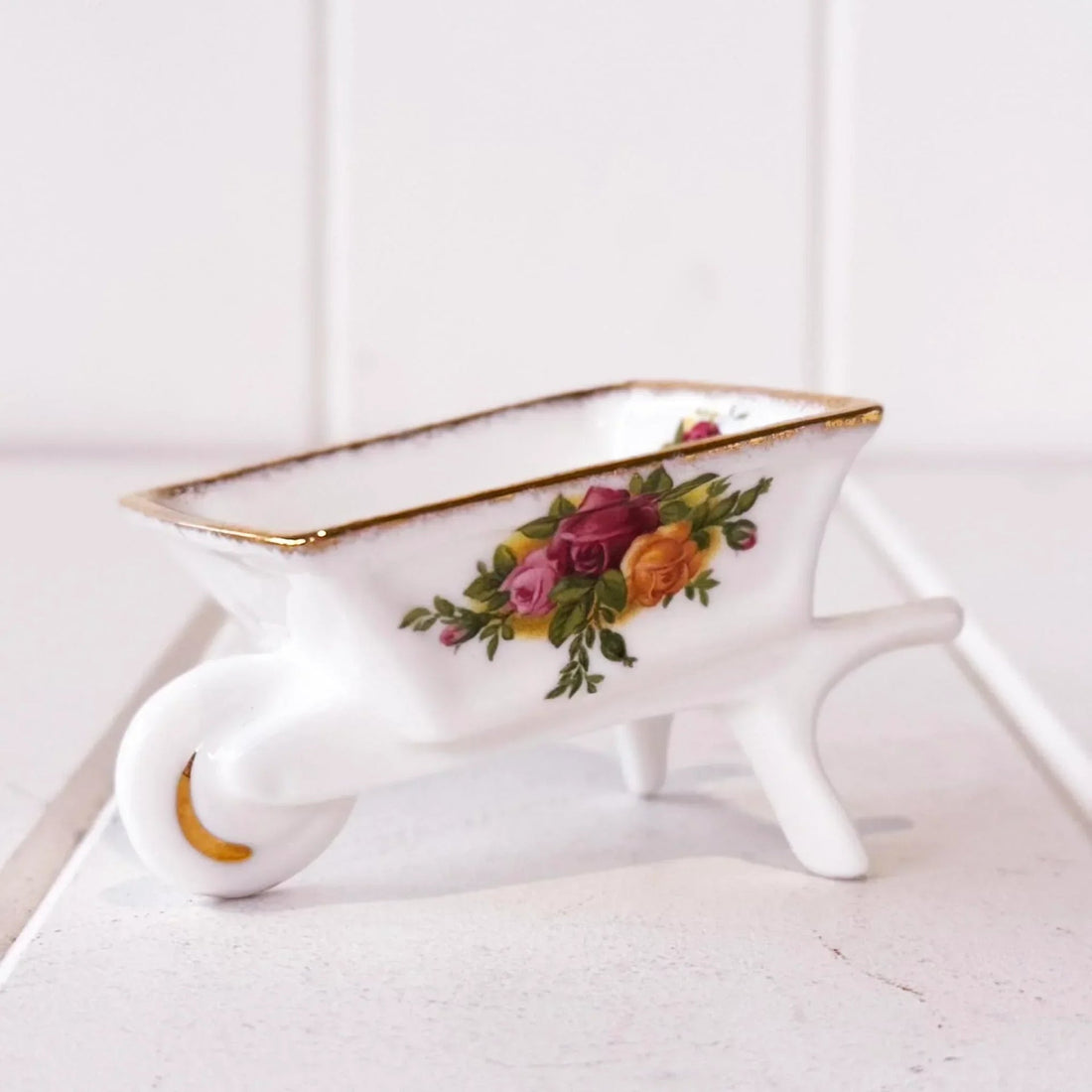 Porcelain wheelbarrow trinket dish with rose floral design and gold trim, vintage home decor accent