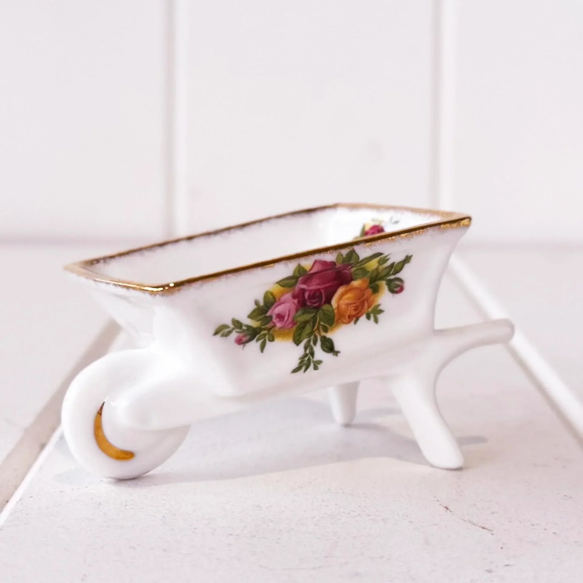 Porcelain wheelbarrow trinket dish with rose floral design and gold trim, vintage home decor accent