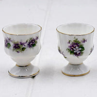Elegant porcelain egg cups with purple violet floral design and gold trim, vintage homeware decor