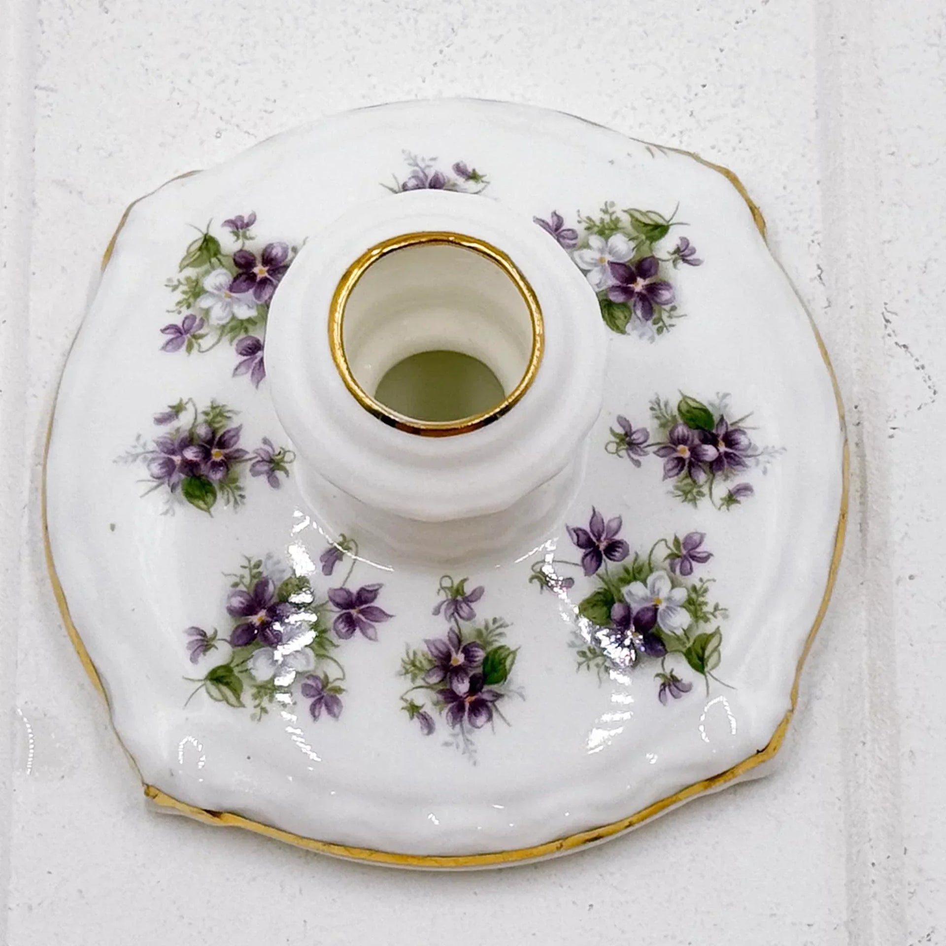 Porcelain candle holder with purple floral design and gold trim, elegant home décor accent