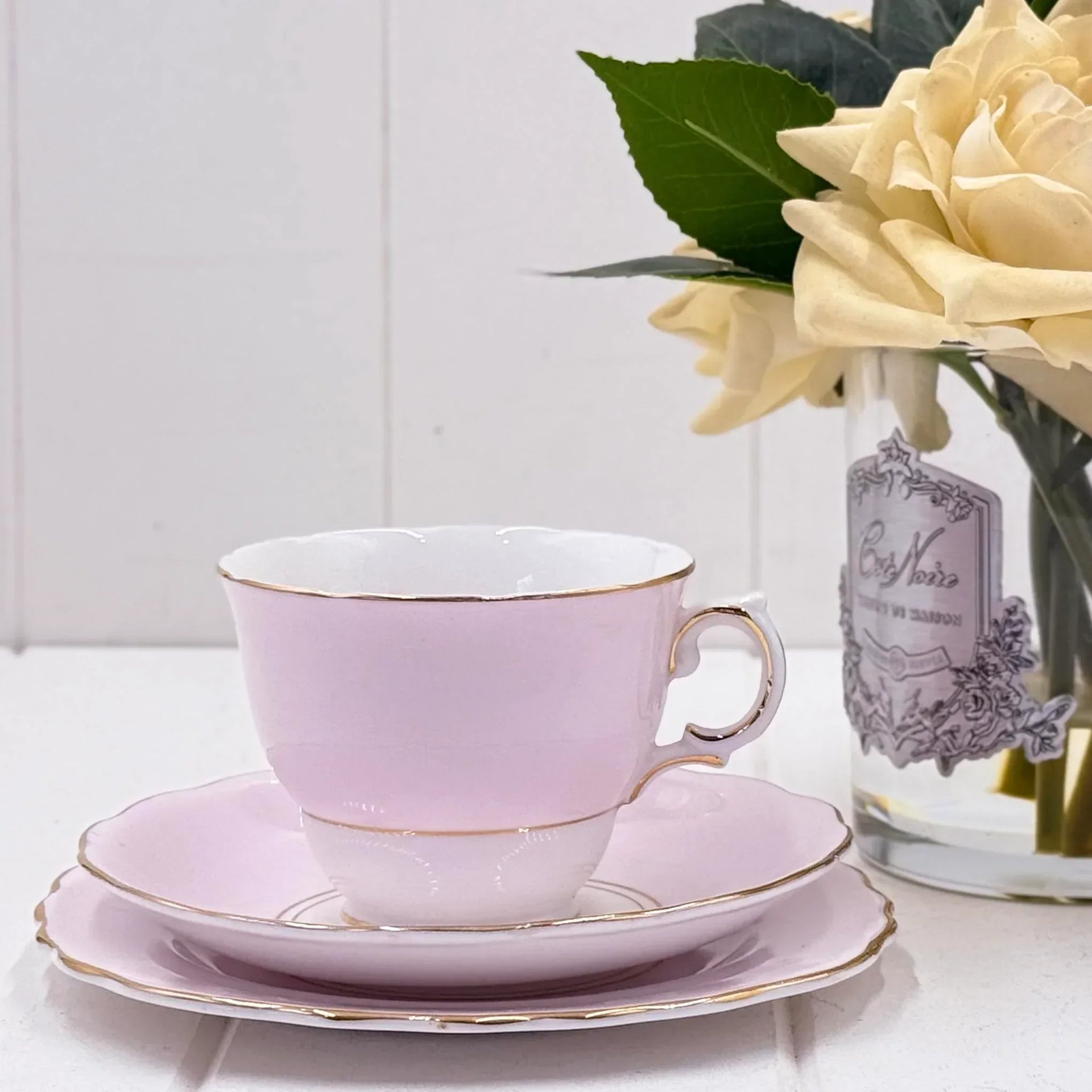Delicate pink teacup with gold trim, vintage-style saucer set, elegant home décor accent