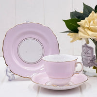 Elegant pink porcelain tea cup and saucer set with gold trim, vintage-style home décor