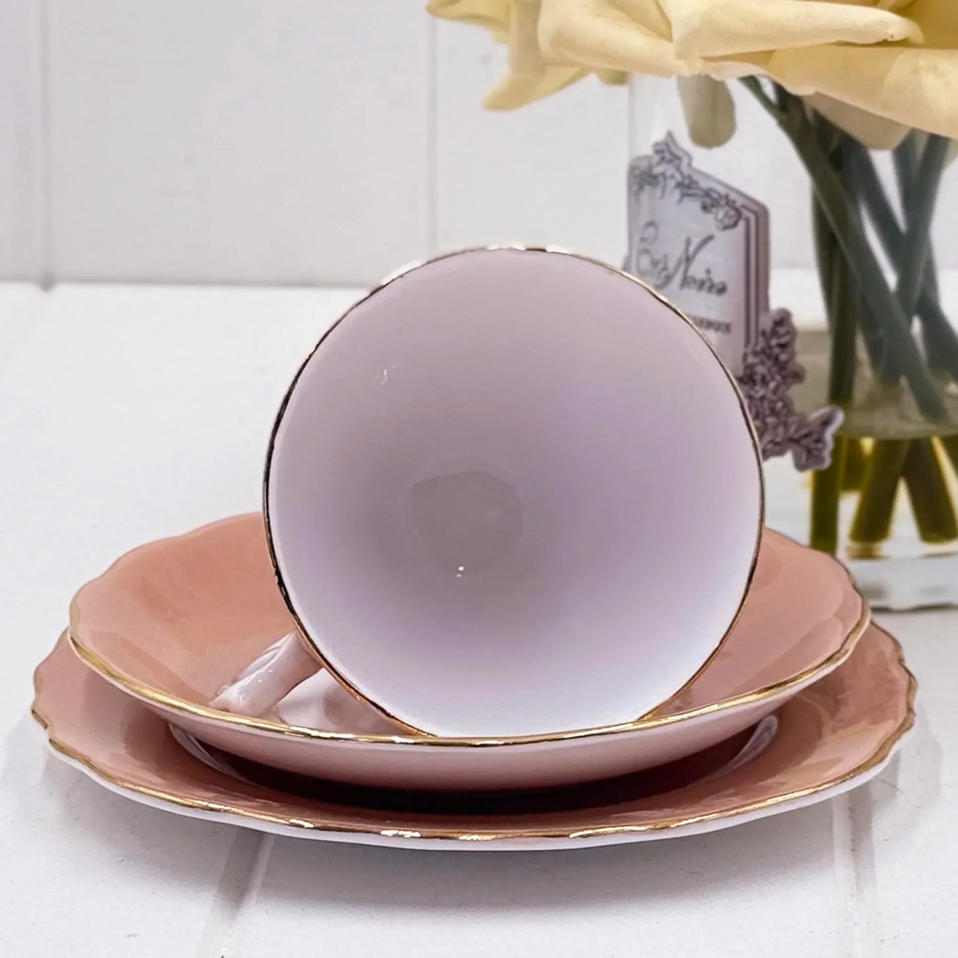 Delicate pink teacup with gold trim, vintage-style saucer set, elegant home décor accent