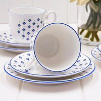 Blue floral patterned ceramic tea cups and saucers with blue rim, elegant home tableware set