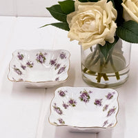 Elegant floral porcelain dishes with gold trim, perfect for vintage home décor and table settings