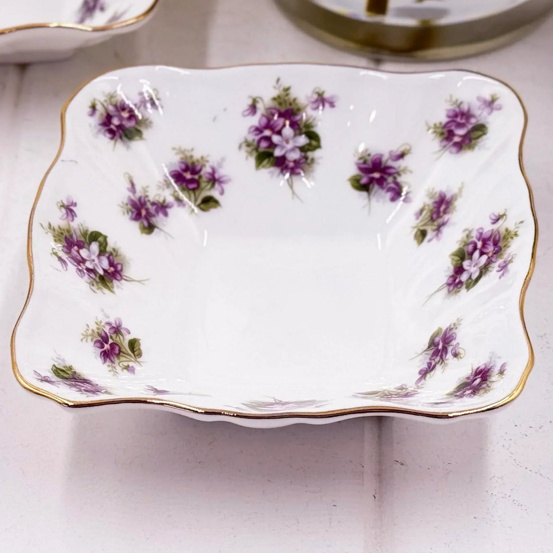 Elegant white porcelain dish with purple floral pattern and gold trim, vintage home décor accent