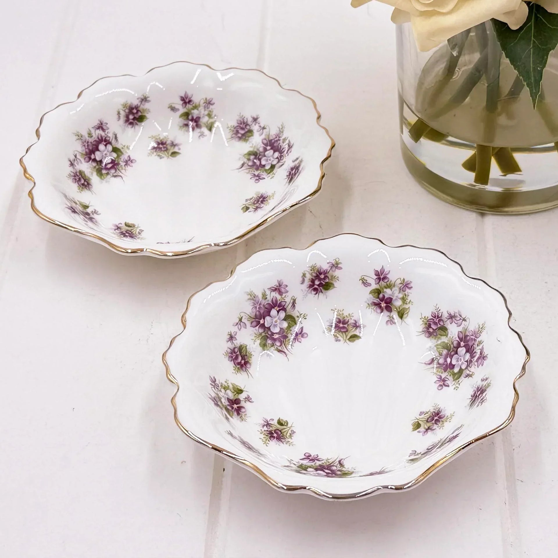 Elegant floral porcelain dishes with gold trim, perfect for vintage home décor and table settings