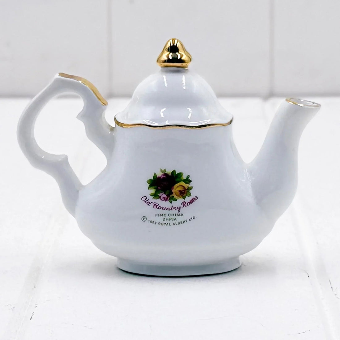 White fine china teapot with gold trim and Old Country Roses floral design, vintage home decor