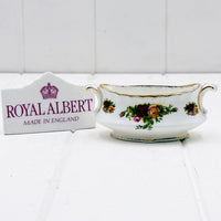 Royal Albert gravy boat with floral rose pattern, gold trim, and 'Made in England' mark, vintage porcelain homeware