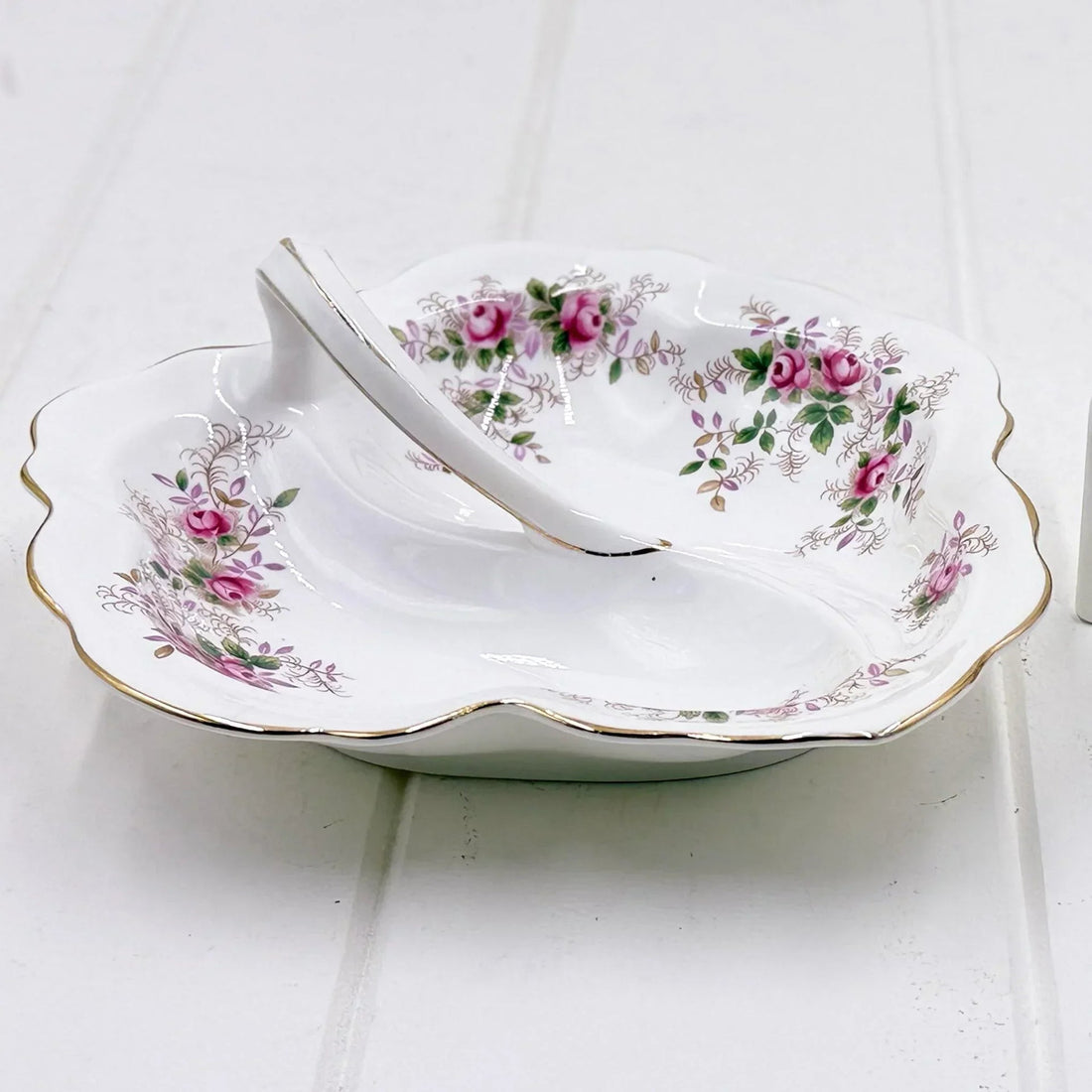 Elegant porcelain dish with pink rose floral pattern and gold trim, vintage-style home decor