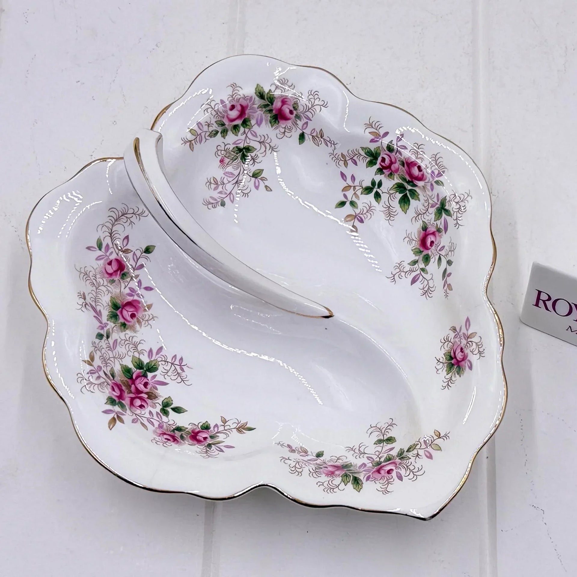 Elegant vintage porcelain dish with pink rose floral pattern and gold trim, perfect for home décor