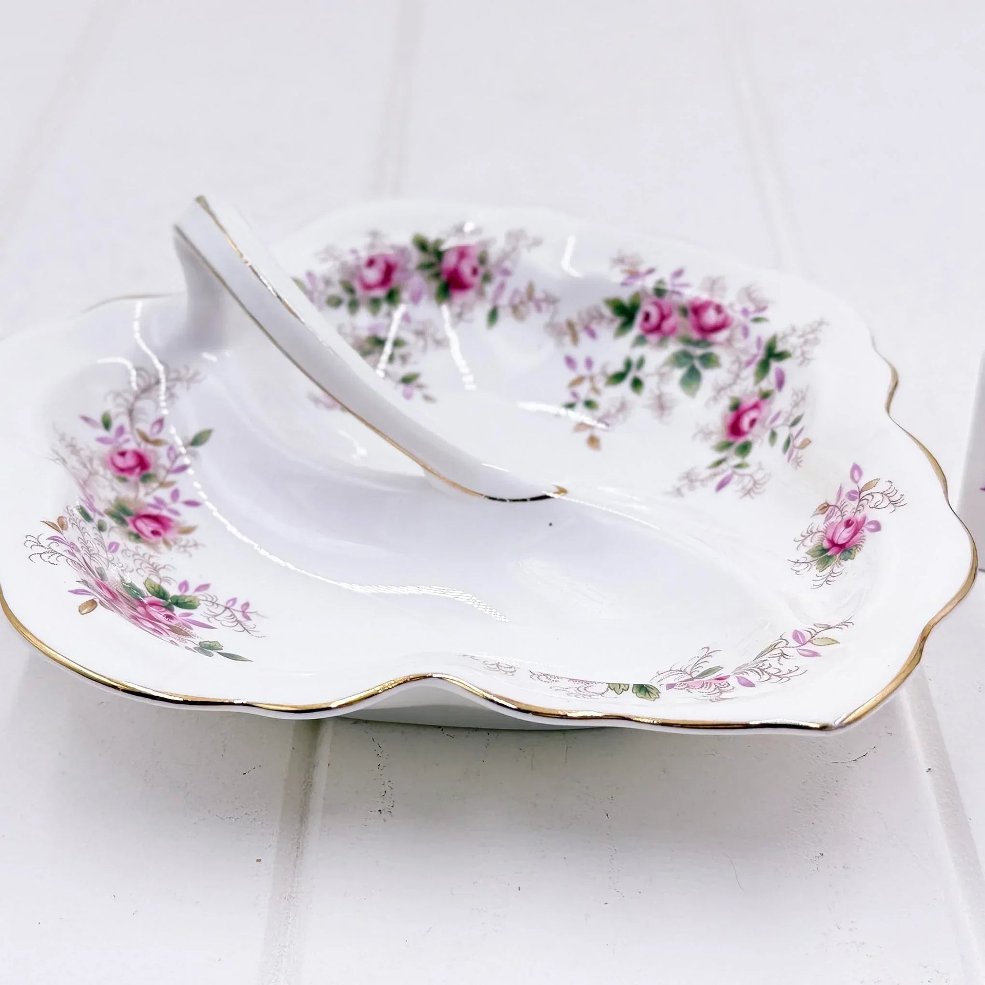 Elegant porcelain dish with pink rose floral pattern and gold trim, vintage-style home décor accent