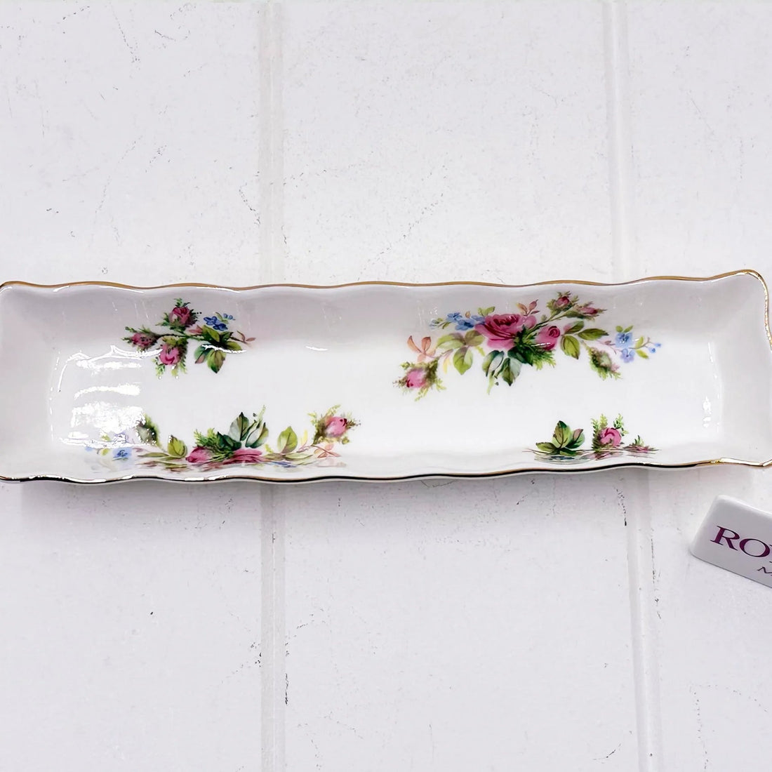 Elegant floral porcelain tray with gold trim, perfect for vintage home décor and serving