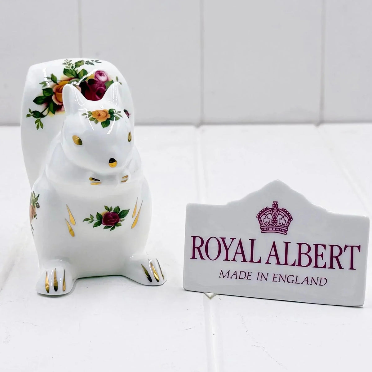 Royal Albert porcelain squirrel figurine with floral design, made in England, elegant home decor accent