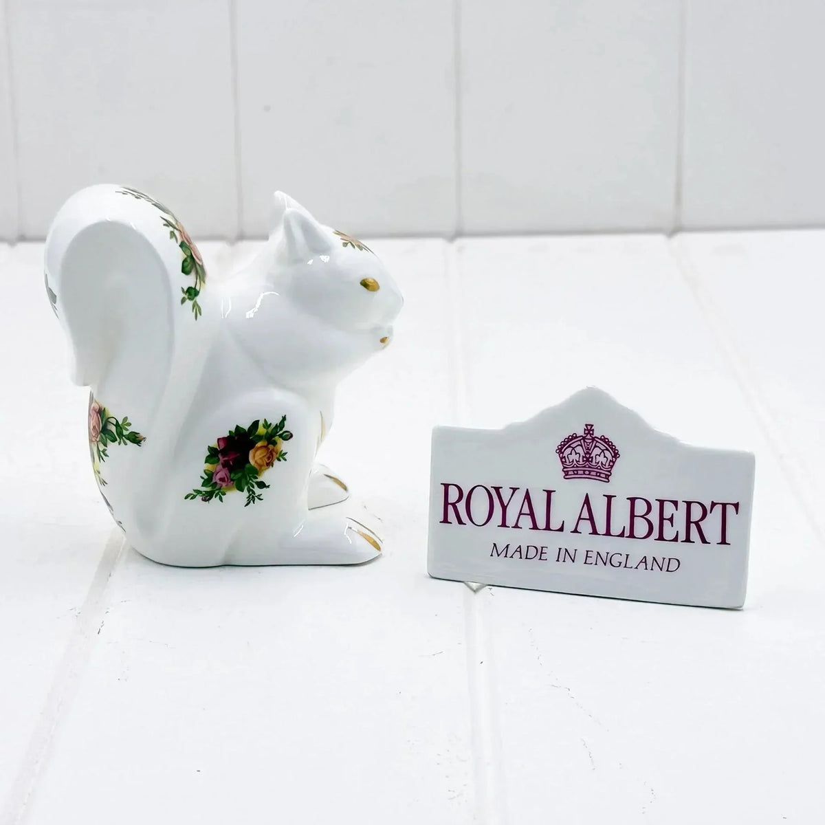 Royal Albert porcelain squirrel figurine with floral rose details, Made in England, elegant home décor accent