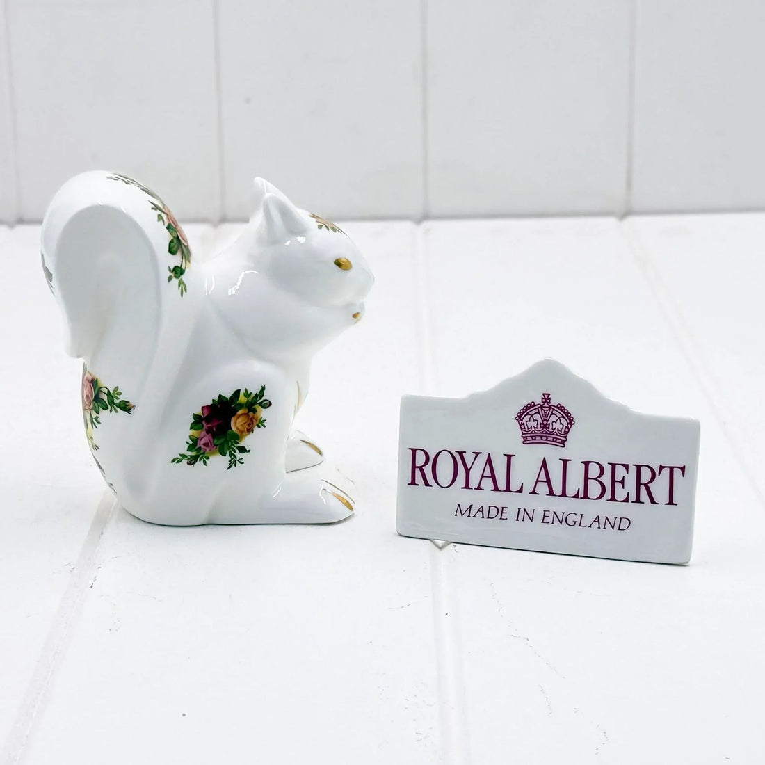 Royal Albert porcelain squirrel figurine with floral rose details, Made in England, elegant home décor accent