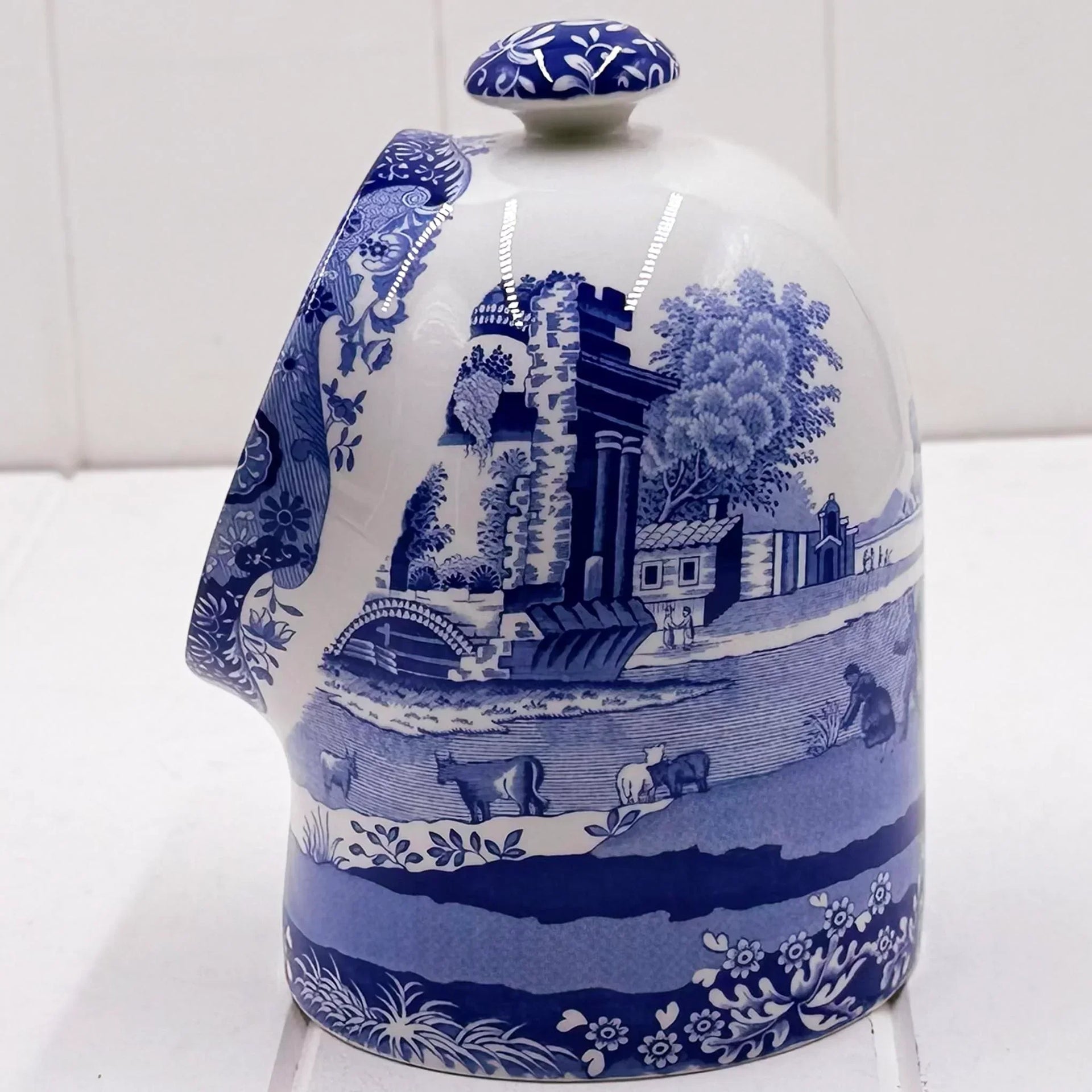 Blue and white ceramic teapot with pastoral scene, vintage-style home decor