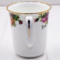Elegant white porcelain mug with pink rose floral design and gold trim, vintage-style home décor