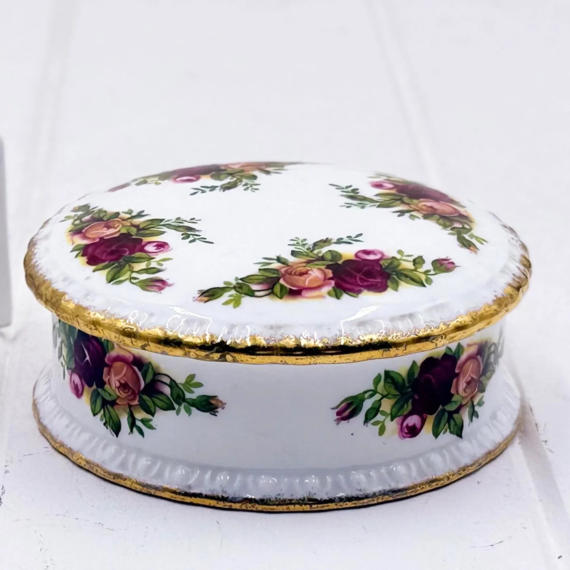 Elegant porcelain trinket box with rose floral design and gold trim, vintage home decor accent