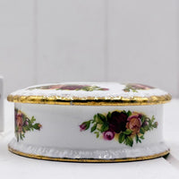 Elegant porcelain trinket box with hand-painted roses and gold trim, vintage home decor accent
