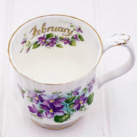 Elegant February floral teacup with purple violets and gold trim, vintage home décor accent