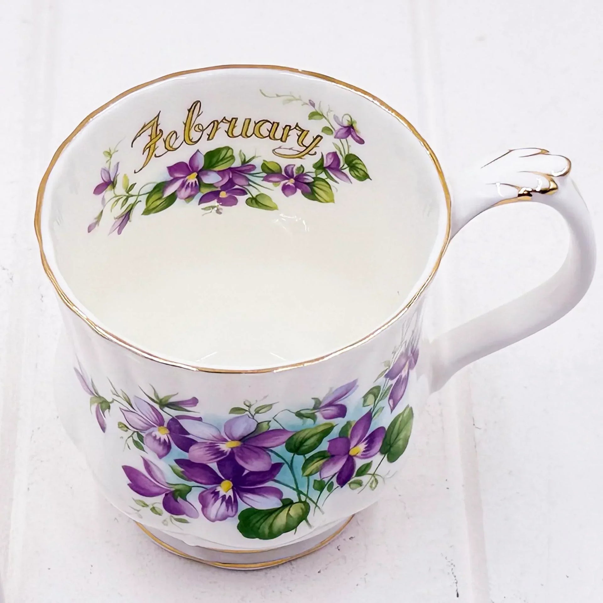 Elegant February floral teacup with purple violets, gold trim, vintage home decor accent