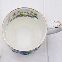 February-themed porcelain teacup with purple violet floral design and gold trim, elegant home décor accent