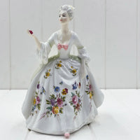 Porcelain figurine of lady in floral gown holding rose, vintage home decor accent piece