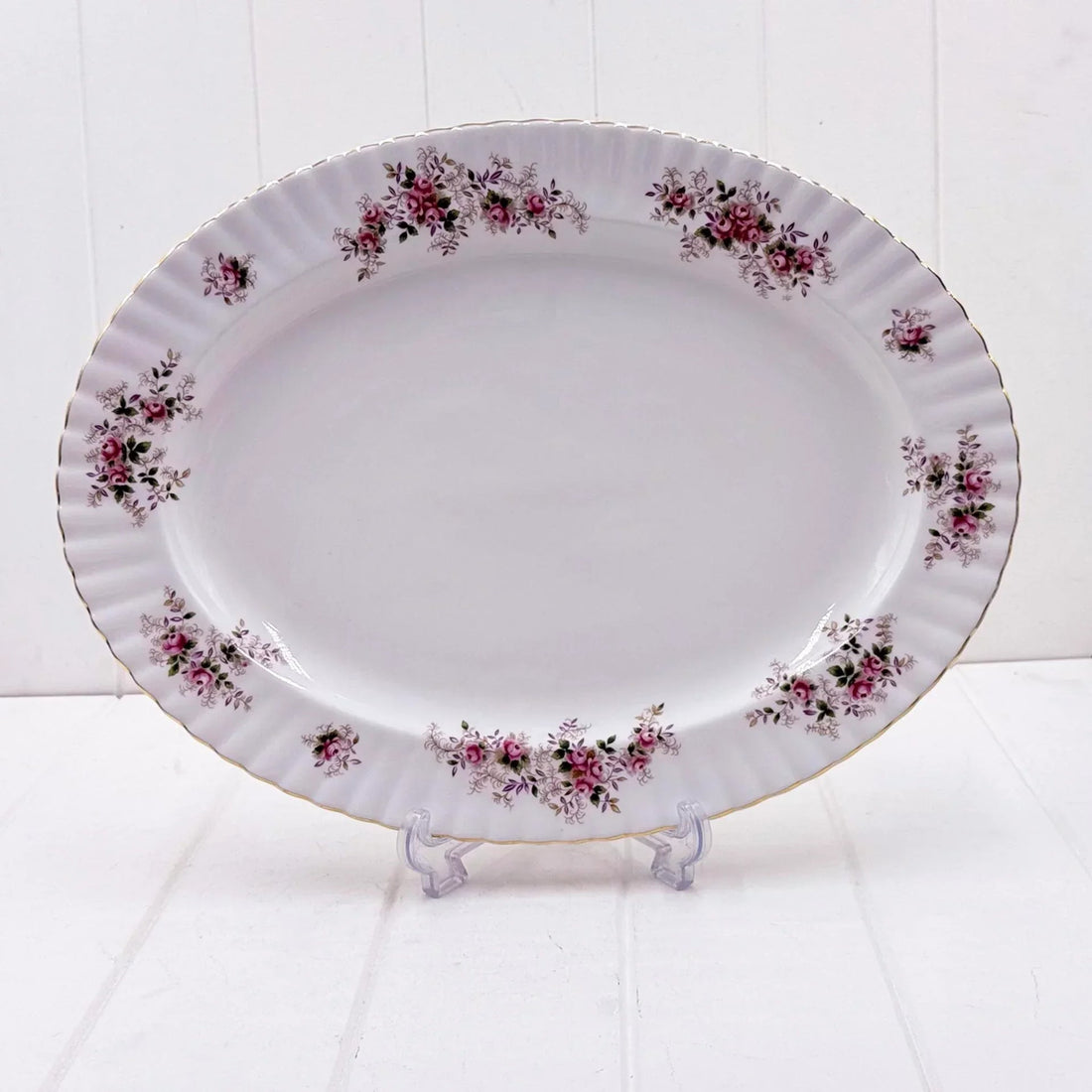 Elegant oval platter with pink rose floral design and gold trim, perfect for vintage home decor
