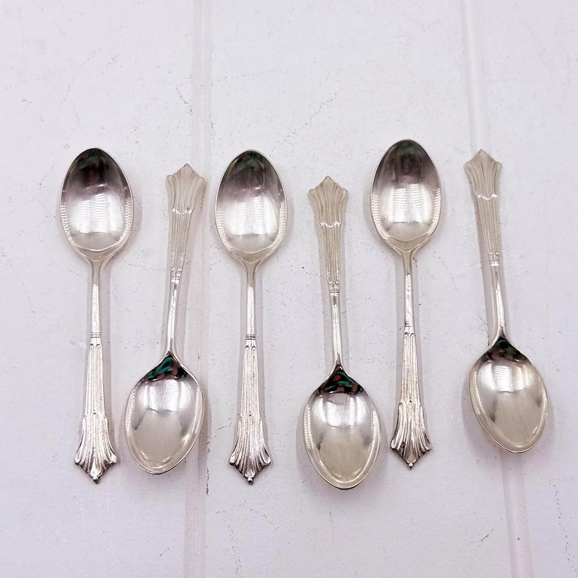Set of six vintage silver teaspoons with ornate handles, elegant home décor accent pieces