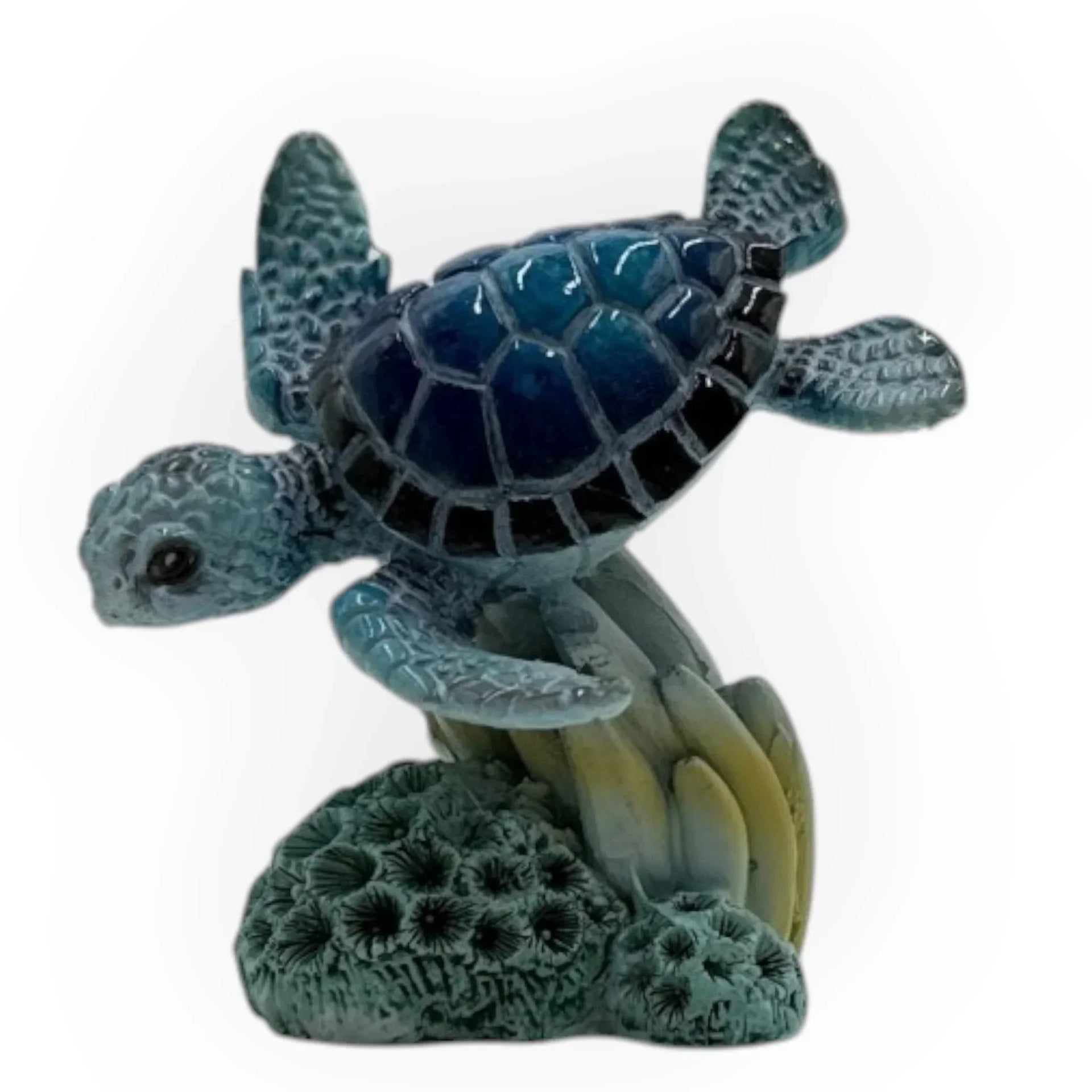 Blue sea turtle figurine on coral base, ocean-themed home décor accent piece